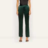 Dark green Rebel Satin Trouser in a slim-straight fit with a flat waistband, worn with a black top and black heeled sandals for a tailored statement.