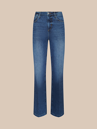 Clayton Wide-Leg Jean in blue stretch denim featuring a wide-leg silhouette, button and zipper closure, and front and back pockets, shown against a light beige background.