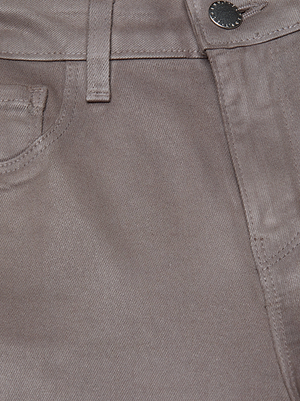 Close-up of the waistband and upper front of the Clayton Coated Wide-Leg Jean by L'AGENCE, highlighting its taupe denim finish, front pocket, belt loop, and metal button.
