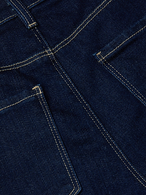 Close-up of L'AGENCE Clayton Wide-Leg Jean in dark wash denim, showcasing standout yellow stitching, belt loops, and two back pockets.