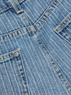 Close-up of the back of Clark Distressed Jean Short in blue stripes, featuring two back pockets and visible seams with contrasting stitching.