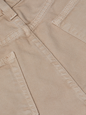 Close-up of pale khaki denim on the Alicent Wide-Leg Jean by L'AGENCE Sale, featuring two stitched back pockets with visible seams and detailed texture.