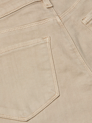 Close-up of beige subtle stretch denim fabric with a back pocket, visible stitching, waistband, and belt loop on the high-rise sneaker-length Alicent Wide-Leg Jean by L’AGENCE.