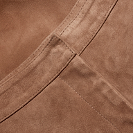 Close-up of brown suede fabric on Livvy Suede Straight-Leg Trouser, showing a straight seam and waistband stitching.