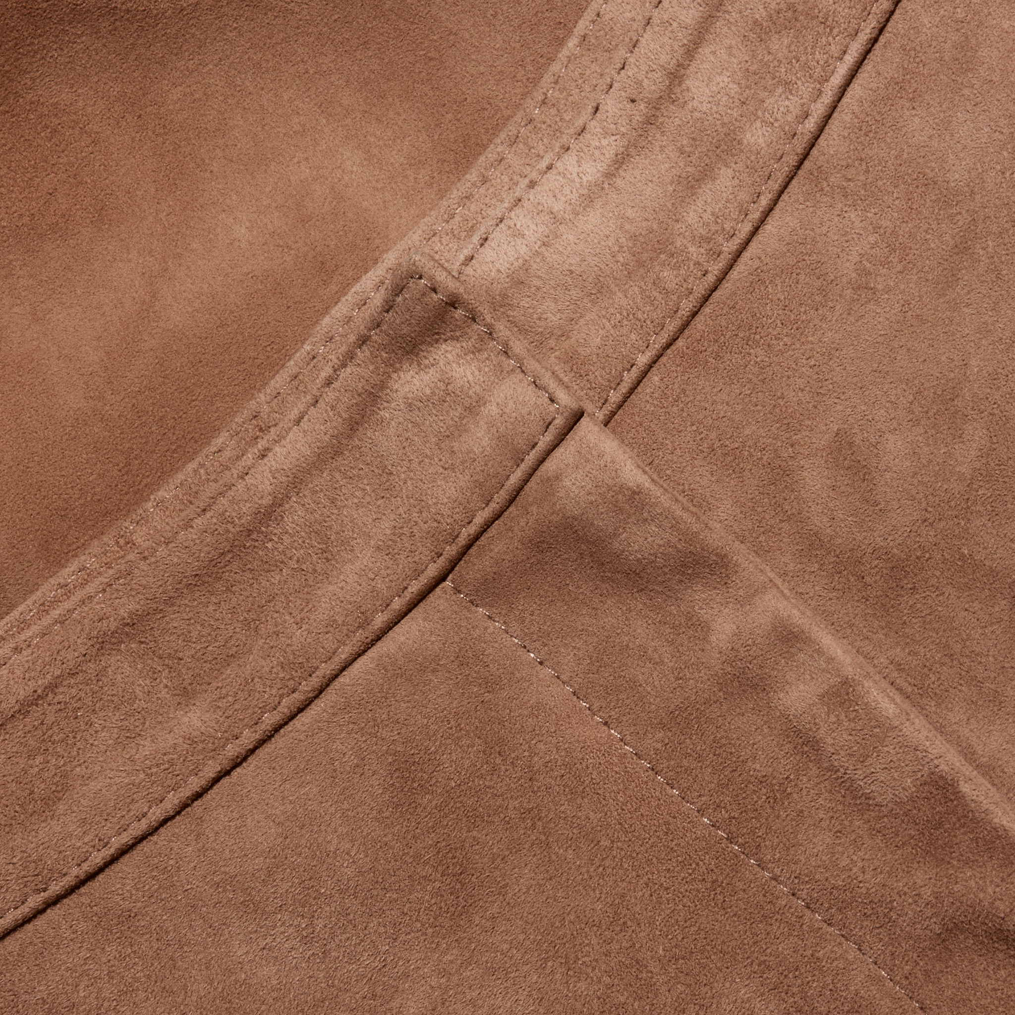 Close-up of brown suede fabric on Livvy Suede Straight-Leg Trouser, showing a straight seam and waistband stitching.