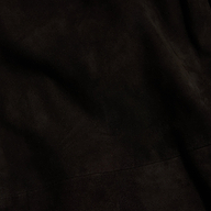 Close-up of a dark, textured fabric with subtle folds and shading, giving the surface a soft, velvety appearance reminiscent of the Livvy Suede Trouser for Fall 2026.