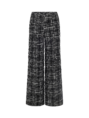 The Livvy Tweed Trouser by L'AGENCE features a high rise and wide-leg silhouette in a black and white textured plaid, offering a modern update to your power suit look. Shown against a white background.