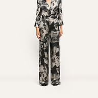 Livvy Silk Straight-Leg Trousers in 100 silk, featuring a black and white magazine print of city scenes and text.