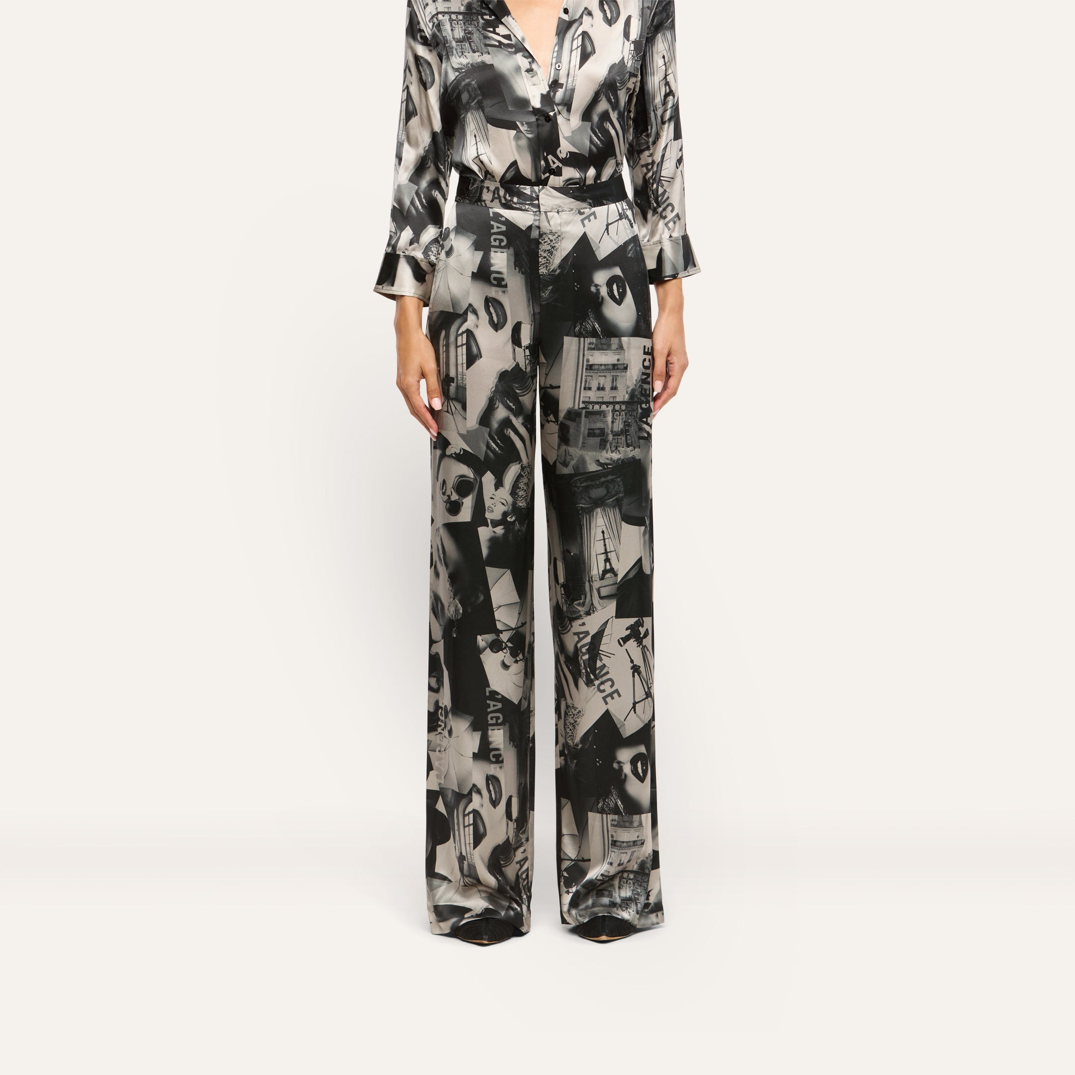 Livvy Silk Straight-Leg Trousers in 100 silk, featuring a black and white magazine print of city scenes and text.