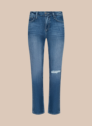 The Nevia Slouchy Straight-Leg Jean features a blue denim slouch fit with a slightly faded, aged medium-dark wash and a rip above the right knee. These jeans have a classic five-pocket design and are displayed against a light beige background.