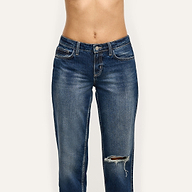 Nevia Slouchy Straight-Leg Jean in an indigo wash with a mid-rise, straight-leg fit and a single distressed tear on the left knee.