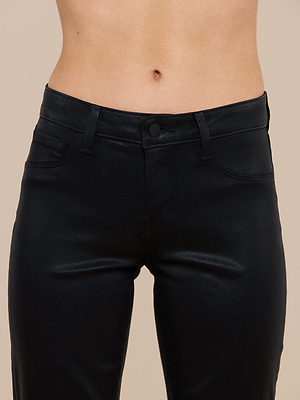 A close-up of a person wearing Sneeki Coated Straight-Leg Jeans, shown from waist to upper thighs with the bare midriff visible above the high-rise waistband.