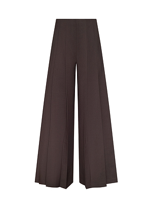 The Nova Pleated Wide-Leg Pant features high-waisted, brown pleated detailing inspired by historical romance, shown on a white background—a timeless style ideal for Fall 2026.