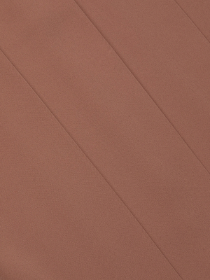 Close-up of textured, fluid suiting fabric in muted coral with diagonal seams forming angled sections—ideal for creating the Nova Pleated Wide-Leg Pant.