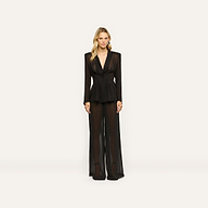 A model wearing a black, sheer long-sleeved blazer and matching Allanah Sheer Trouser wide-leg trousers.