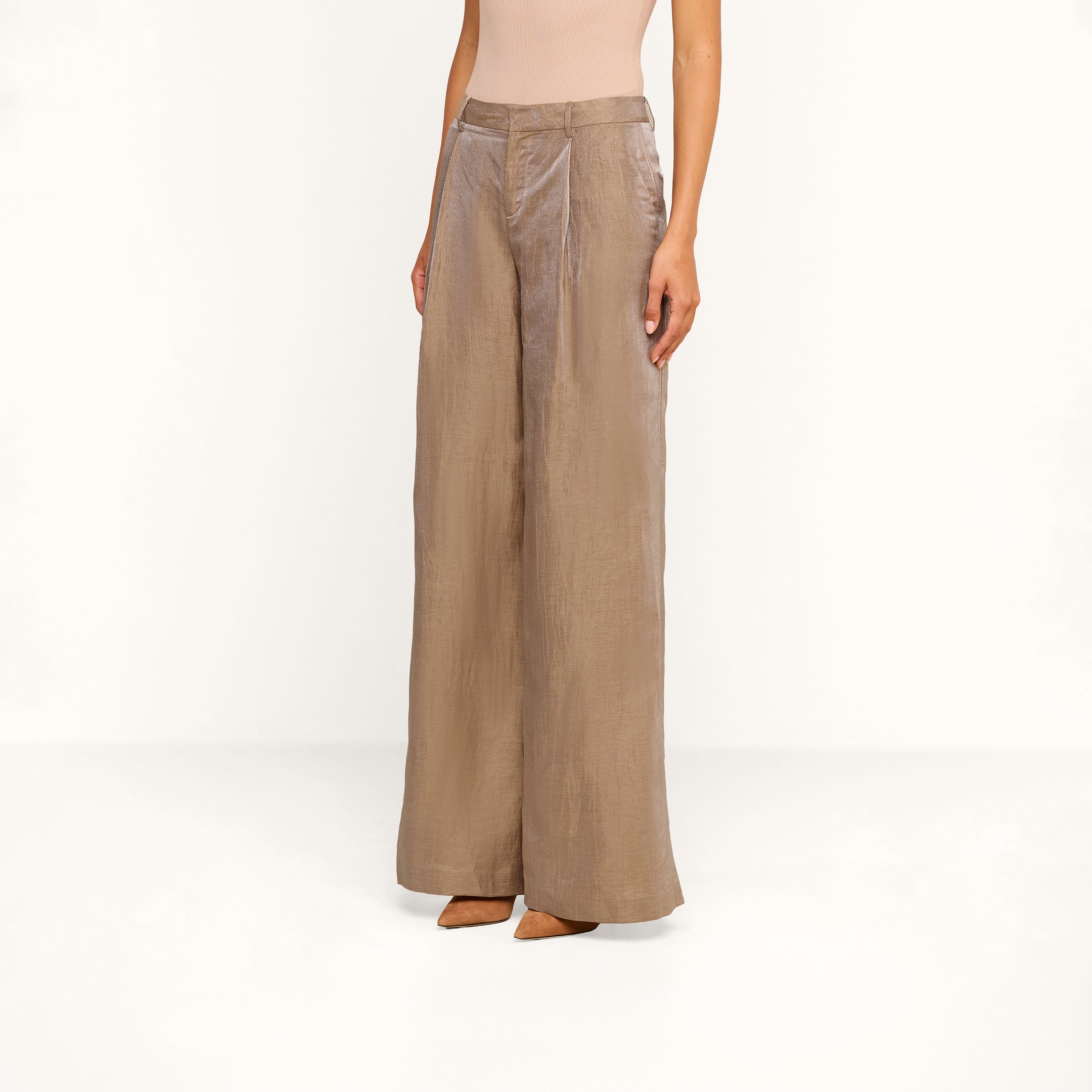 A person wearing the Allanah Linen-Blend Trouser in latte brown, styled with tan pointed-toe heels, stands against a plain white background with only the lower half of their body visible.