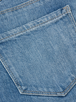 Close-up of the back pocket on the Mira Cropped Bootcut Jean, highlighting its blue ultra high-rise denim fabric texture and detailed edge stitching.