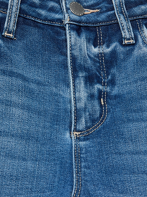 Close-up of the front of the Scottie Wide-Leg Jean in blue denim, highlighting the waistband, button, zipper, belt loops, and detailed stitching.