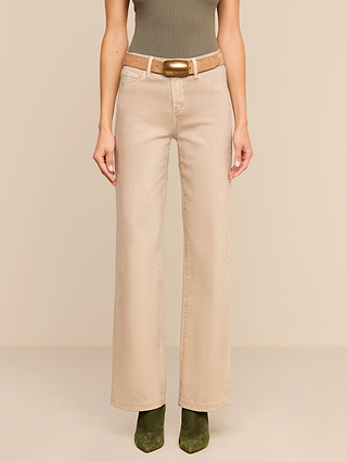 A person wearing the Scottie Coated Wide-Leg Jean in beige with a matching beige belt, a dark green sleeveless top, and olive green ankle boots stands against a plain beige background.