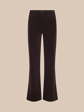 The Scottie Velvet Wide-Leg Jean in dark brown features a high rise, wide-leg silhouette, front button closure, and pockets, displayed against a plain beige background—perfect for elevating your transitional wardrobe.