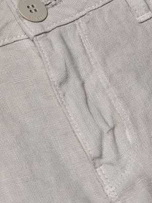 Close-up of Gina Linen Short in breathable light beige or gray fabric, highlighting the waistband, button, belt loop, and top of pocket with visible stitching.