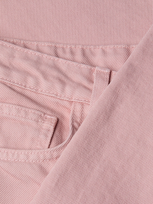 Close-up of the Blaine Cropped Stovepipe Jean in light pink all-cotton denim, highlighting the waistband, a belt loop, and part of the front pocket with visible stitching details.