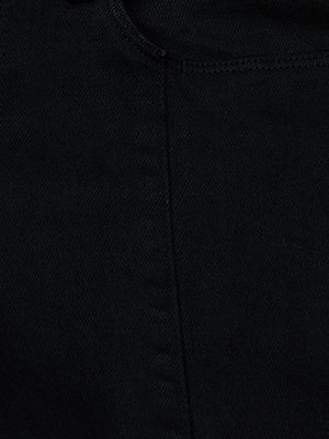 Close-up view of the Lenora Low-Rise Flare Jean by L'AGENCE in black wash denim, featuring visible stitching along the seam and a subtly textured surface.