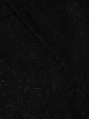 Close-up of black floral lace fabric with intricate detailing and a slightly raised texture. Soft and delicate, this fabric is perfect for crafting the elegant Livvy Lace Trouser in high rise or straight-leg styles.