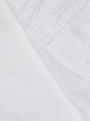 Close-up of the Krista Tapered Jean in white, featuring the seam and part of a pocket that highlights the textured fabric and detailed stitching of these high-rise, tapered leg jeans.