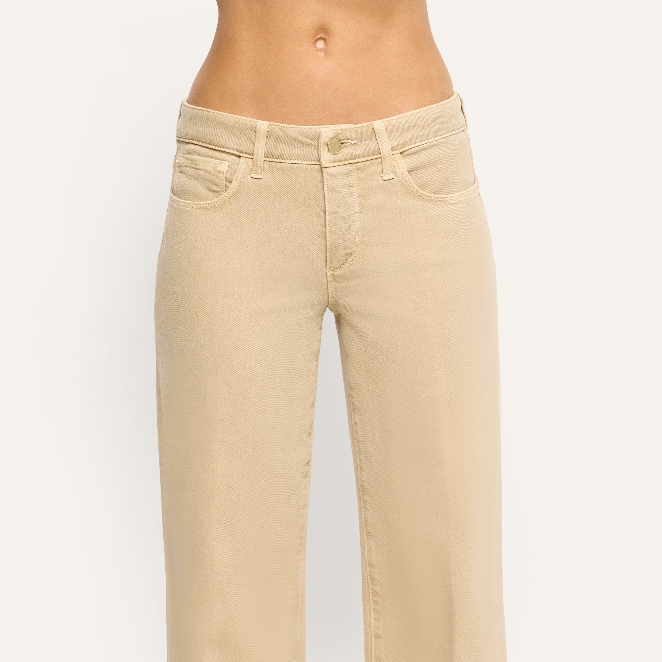 Joanne Low-Rise Wide-Leg Jean in beige, featuring a low-rise fit, wide legs, stretch denim, and a front button closure.
