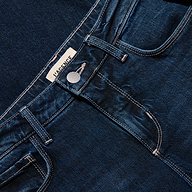 Close-up of the waistband, button, and pockets of the dark blue stretch denim Joanne Low-Rise Wide-Leg Jean.
