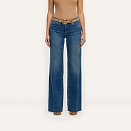 Joanne Low-Rise Wide-Leg Jean in indigo, styled with a tan suede belt.