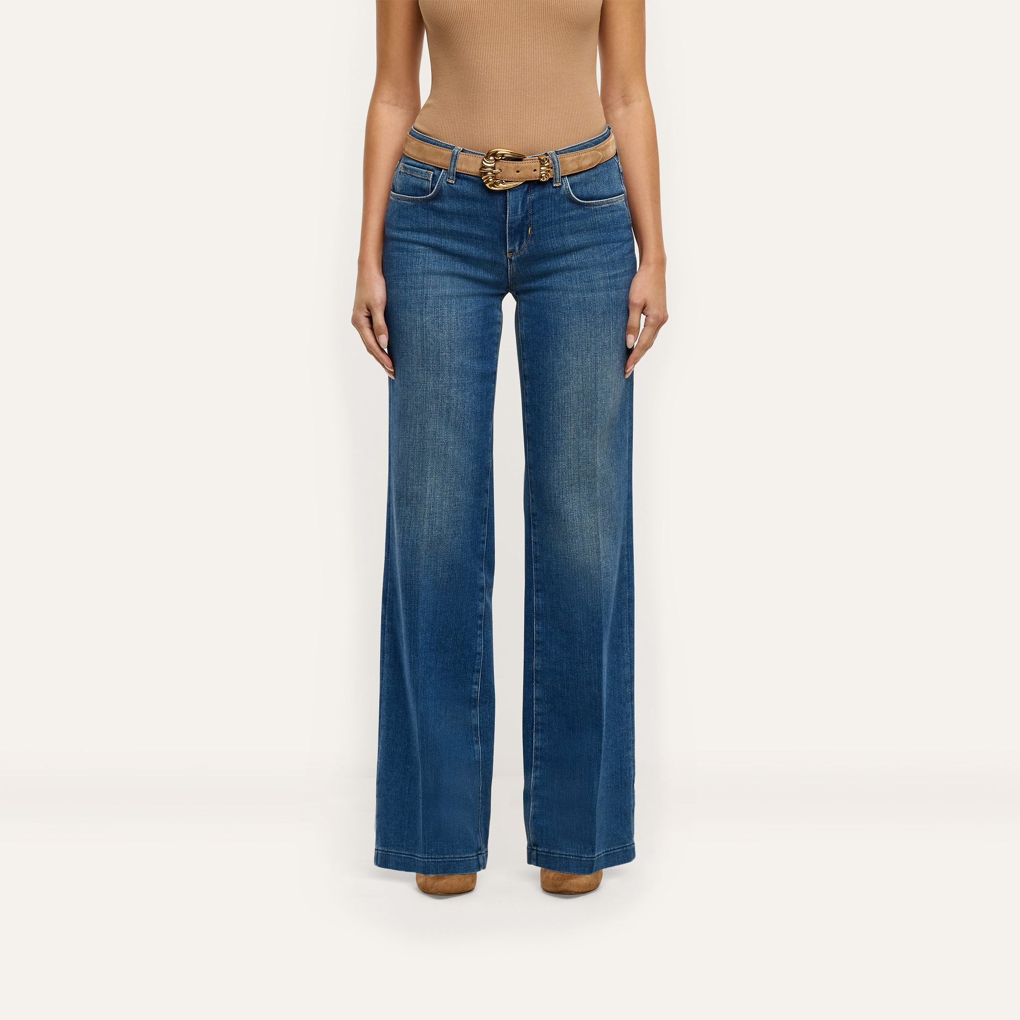 Joanne Low-Rise Wide-Leg Jean in indigo, styled with a tan suede belt.