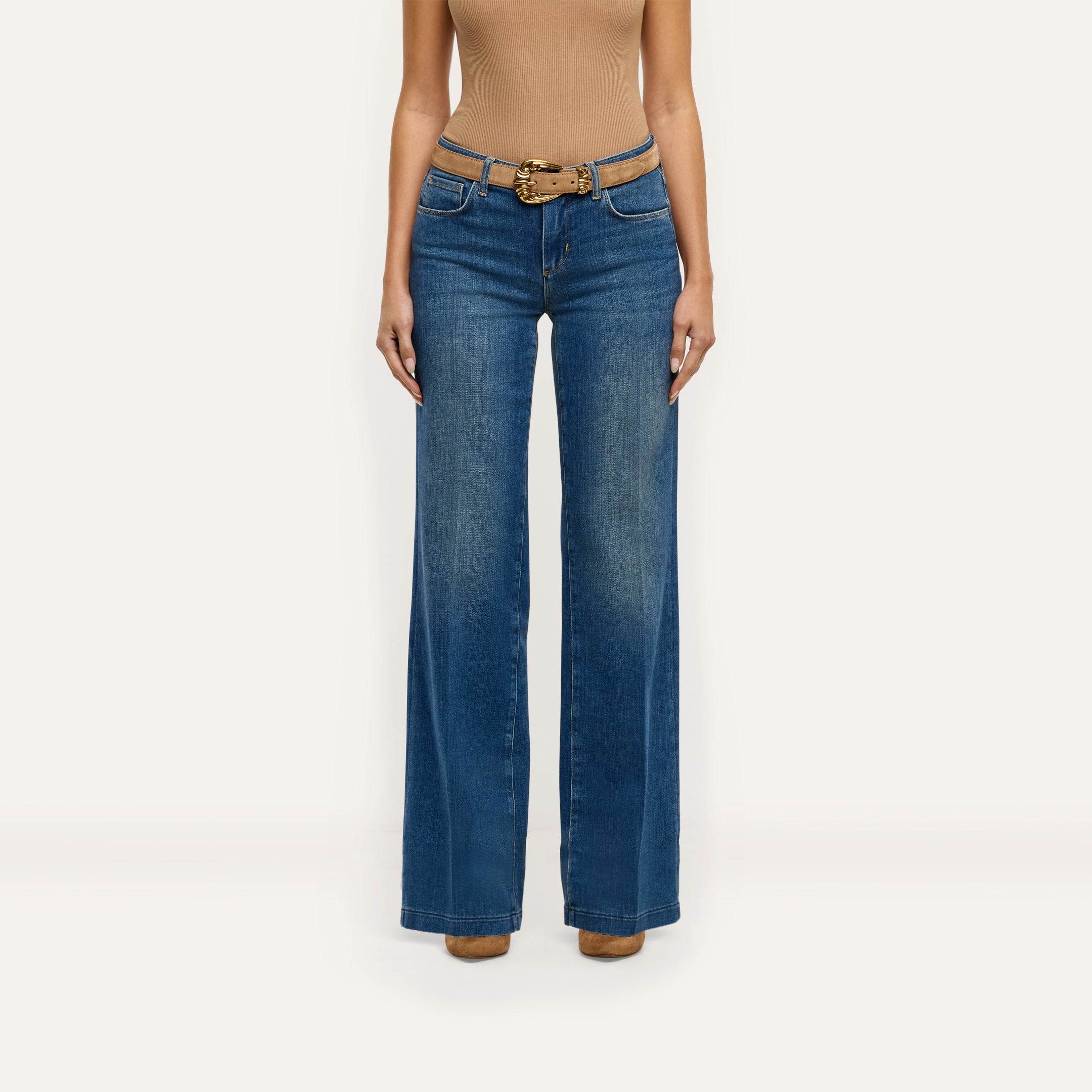Joanne Low-Rise Wide-Leg Jean in indigo, styled with a tan suede belt.