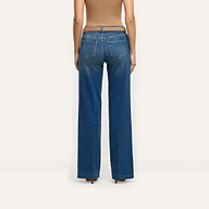 Back view of a person wearing Joanne Low-Rise Wide-Leg Jean in an indigo wash with a brown belt and a tan top.