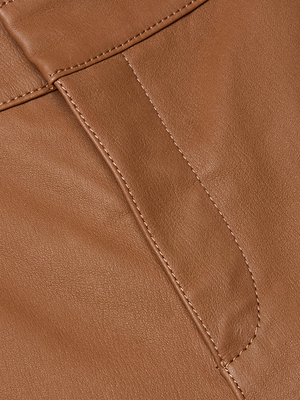 Close-up of the Ketra Leather Bootcut Trouser in brown lambskin, highlighting visible seam lines, stitching detail on the pocket, and its smooth, supple texture.