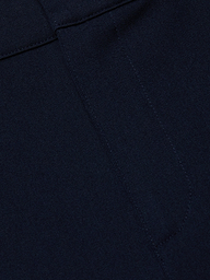 Close-up of midnight navy stretch fabric from the Ketra Bootcut Trouser, featuring visible stitching and seam lines. The material has a smooth yet slightly textured appearance.