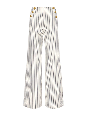 The Kingston Striped Wide-Leg Pant by L'AGENCE Sale features white linen-cotton fabric, vertical black pinstripes, gold buttons on each side, and a high waist.