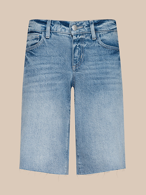 The Elise Jean Bermuda Short features a light blue wash, relaxed fit, frayed hem, front pockets, belt loops, and a button closure, shown against a beige background.