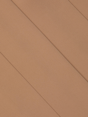 Close-up of the Novalynn Cropped Pleated Pant by L'AGENCE, featuring light brown fabric with a diagonal overlapping pattern and a smooth, textured surface—ideal for stylish cropped trousers.