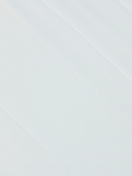 White surface with subtle diagonal shadows and texture, capturing the minimalist and clean aesthetic reminiscent of the polished design found in the Novalynn Cropped Pleated Pant.