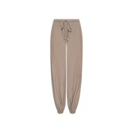 Mariko Jogger in light cardamom brown, crafted from water-repellent nylon, featuring an elastic waistband and cuffs with a front drawstring tie, displayed on a plain white background.