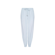 The Mariko Jogger, made from light blue lightweight nylon, features an elastic waistband with a drawstring tie and elastic cuffs at the ankles, shown against a white background.