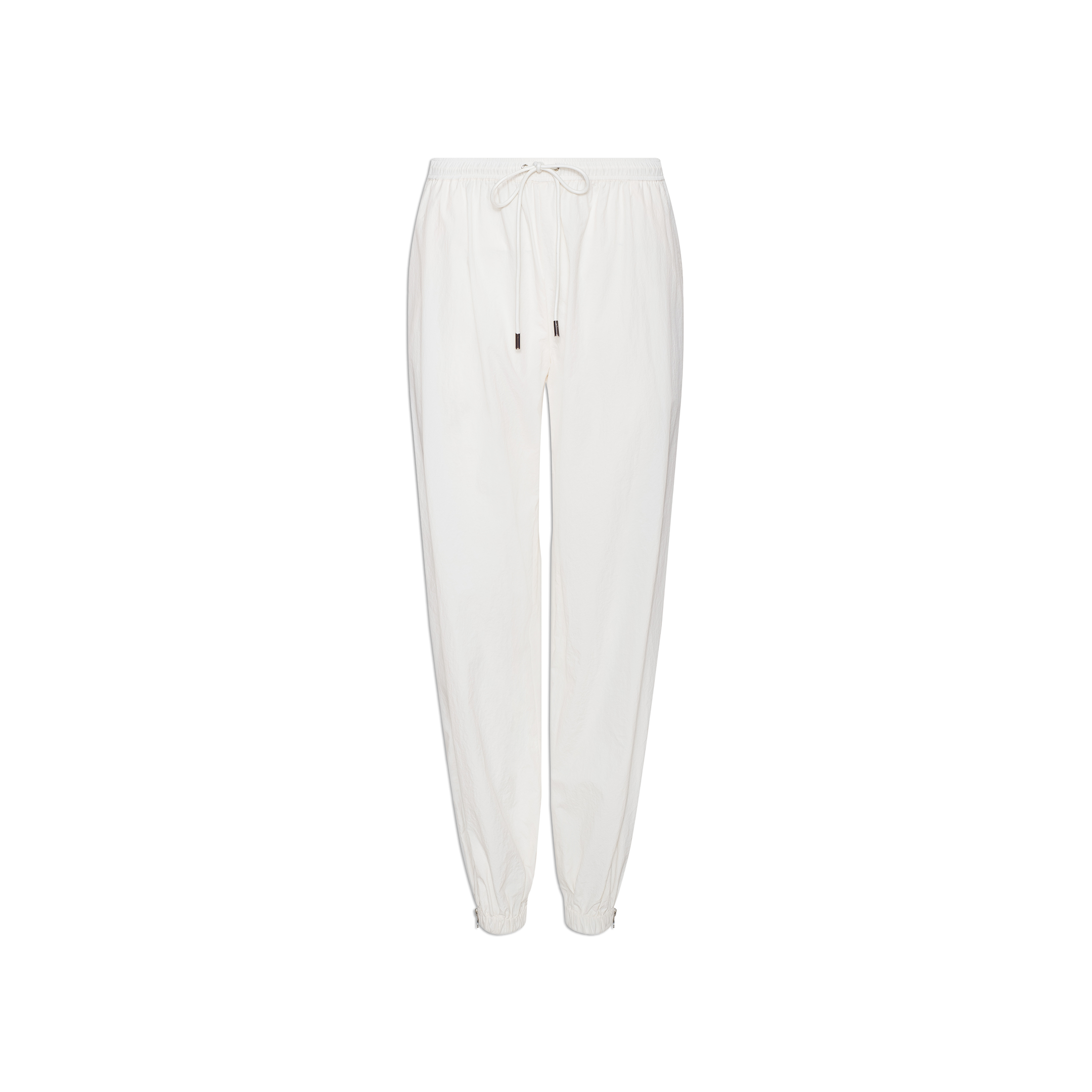 The Mariko Jogger in ivory, made from water-repellent nylon, features an elastic waistband, drawstring, and elastic cuffs, and is displayed on a plain white background.