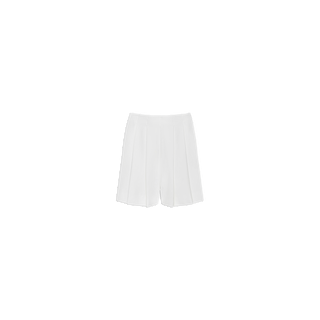 The Naamah Pleated Short, crafted from fluid suit fabric for a sophisticated look, features a white high-waisted design with elegant pleats and is displayed on a plain white background. Perfect for your resort rotation, these shorts offer both style and comfort.