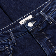 Close-up of Celestia Slim-Leg Jean, featuring a dark wash, ultra high-rise fit, metallic button, and white contrast stitching.
