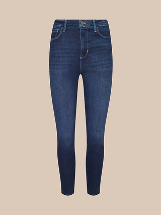 A pair of Celestia Slim-Leg Jeans in dark indigo wash, featuring front and back pockets, belt loops, a button closure, and crafted from classic stretch denim, displayed on a plain beige background.