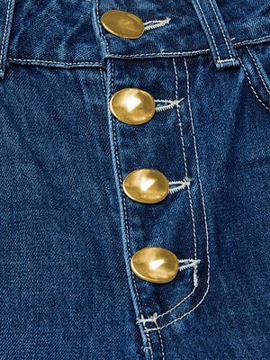 Close-up of the Liora Cropped Jean by L'AGENCE, featuring blue denim, a high-rise fit, four shiny gold buttons, and white stitching along the fly and waistband.