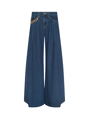 The L'AGENCE Chayse Wide-Leg Jean features super wide legs, a high waist, non-stretch blue denim, and a statement chain detail on the left side, shown against a white background.