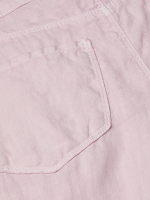 Close-up of a light pink fabric pocket on the Amara Linen Wide-Leg Pant, highlighting the stitching and texture of the material.